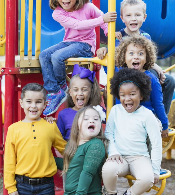 kids group photo on a playground.